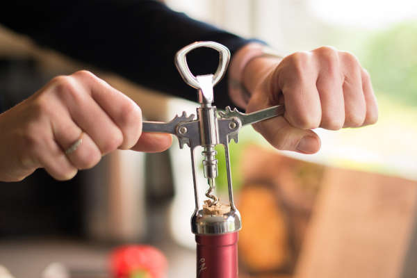 generic image of a person using a cork screw